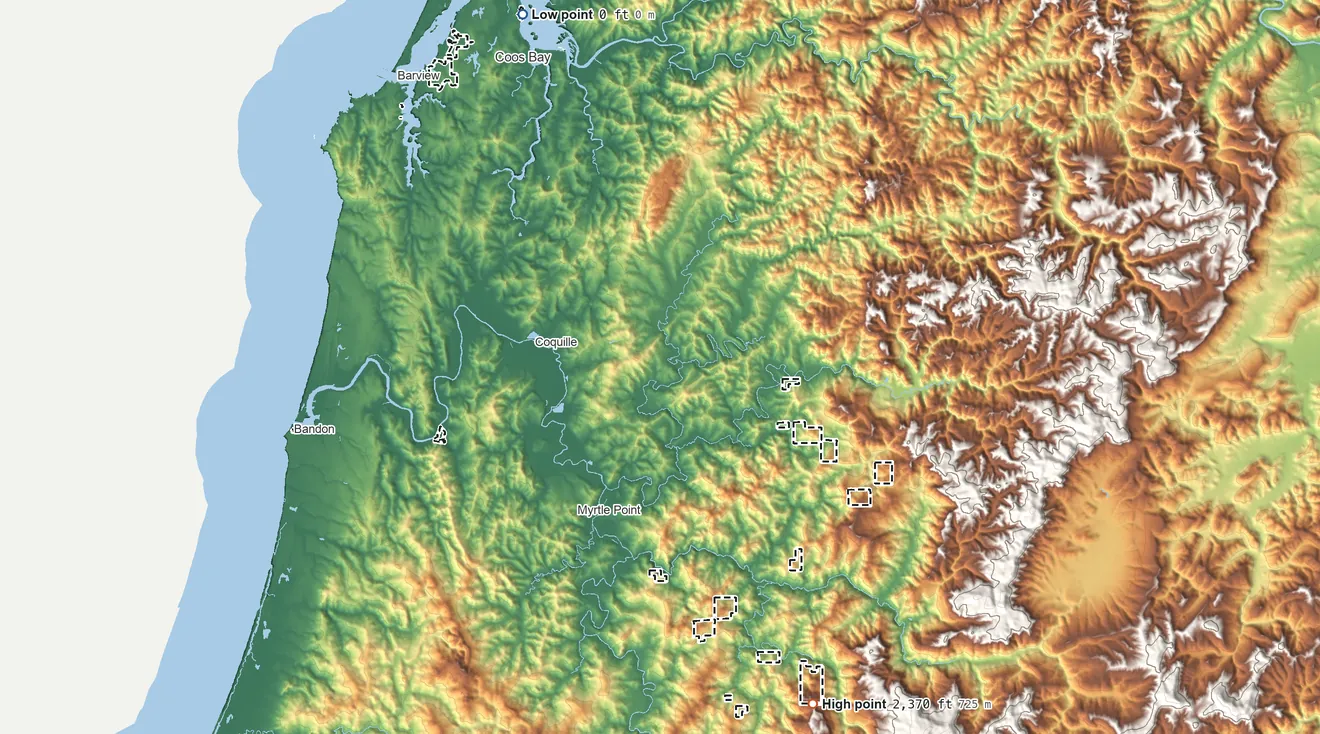 Topographic elevation map of Coquille Reservation, Oregon, shaded from sea level on Coos Bay to 2,370 ft on the southeast side