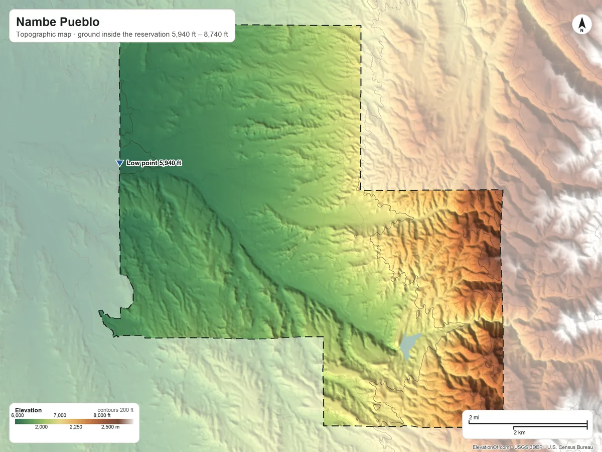 Topographic elevation map of Nambe Pueblo, New Mexico, shaded from 5,940 ft on the west side to 8,740 ft on the east side