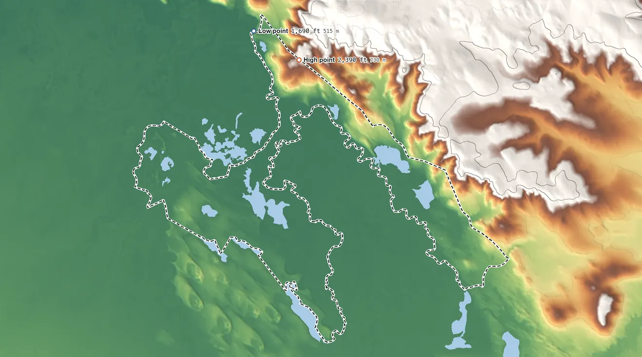 Topographic elevation map of Northway ANVSA, Alaska, shaded from 1,690 ft on the northwest side to 2,390 ft on the north side