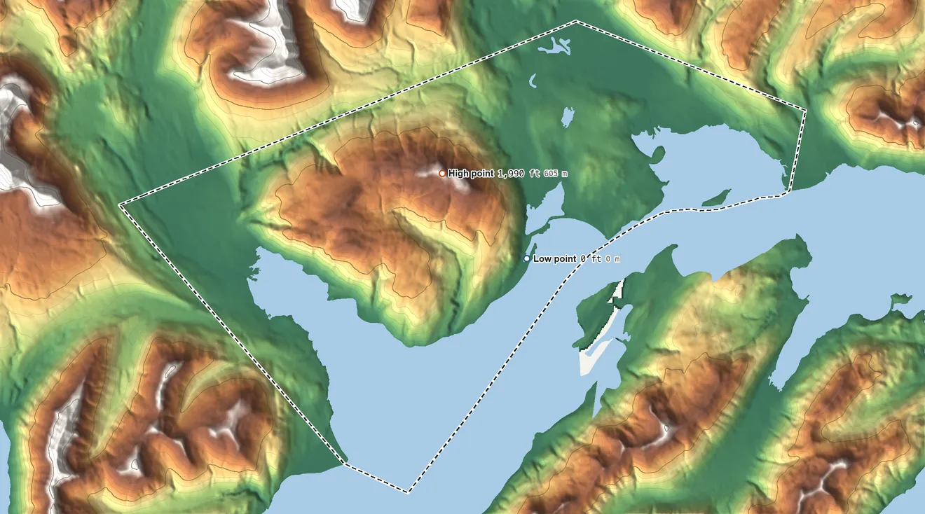 Topographic elevation map of Old Harbor ANVSA, Alaska, shaded from sea level on the Sitkalidak Strait to 1,990 ft on the north side