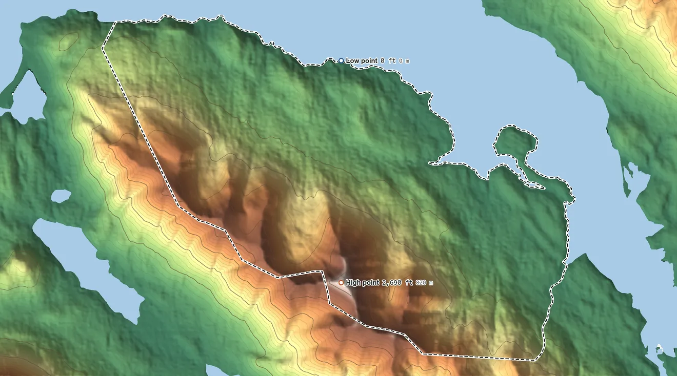 Topographic elevation map of Port Graham ANVSA, Alaska, shaded from sea level on the Port Graham to 2,690 ft on the south side