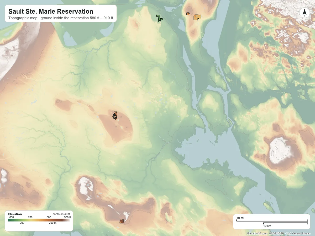 Topographic elevation map of Sault Ste. Marie Reservation, Michigan, shaded from 580 ft on the southwest side to 910 ft on the west side