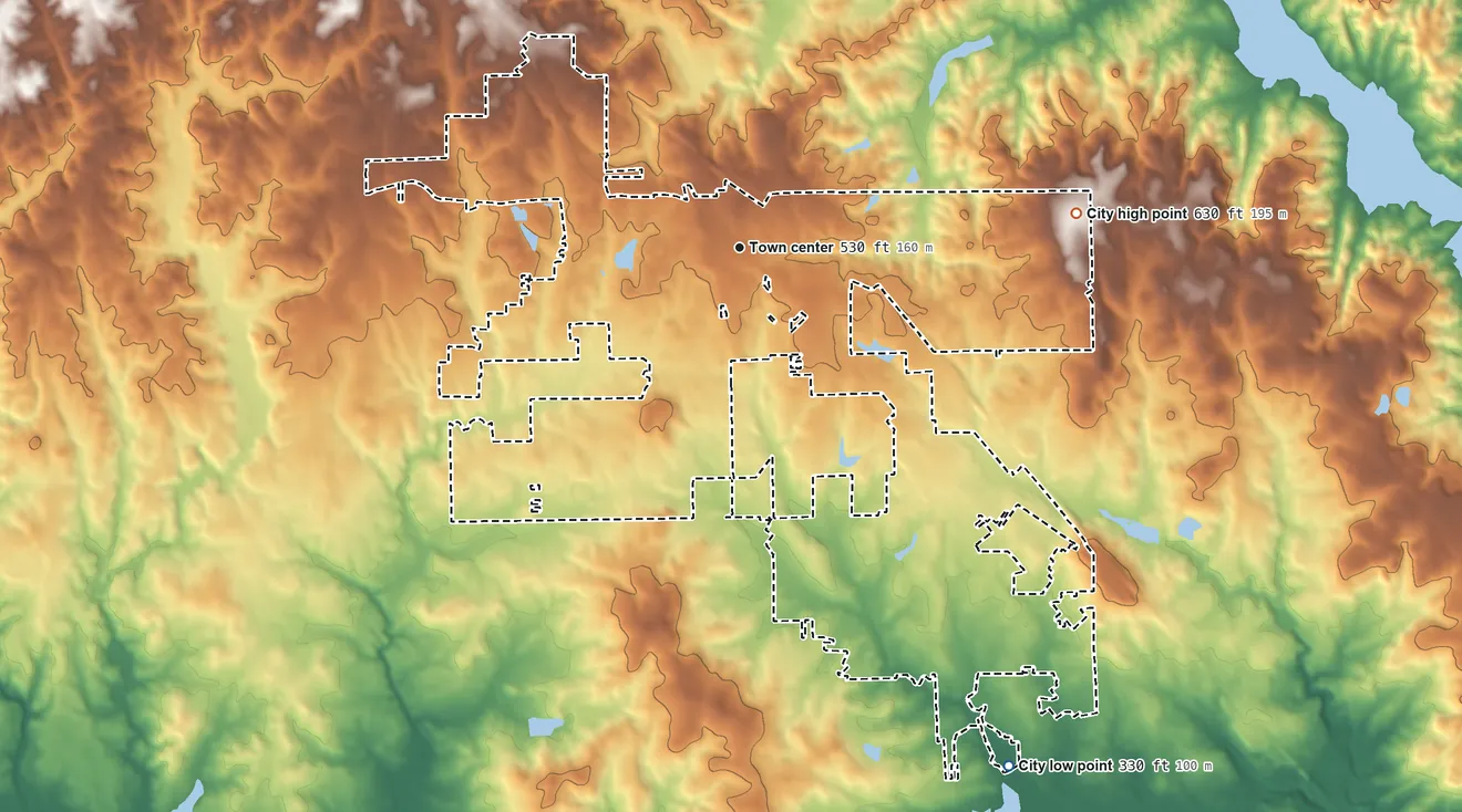 Topographic elevation map of Smiths Station, Alabama, shaded from 330 ft on the southeast side to 630 ft on the east side