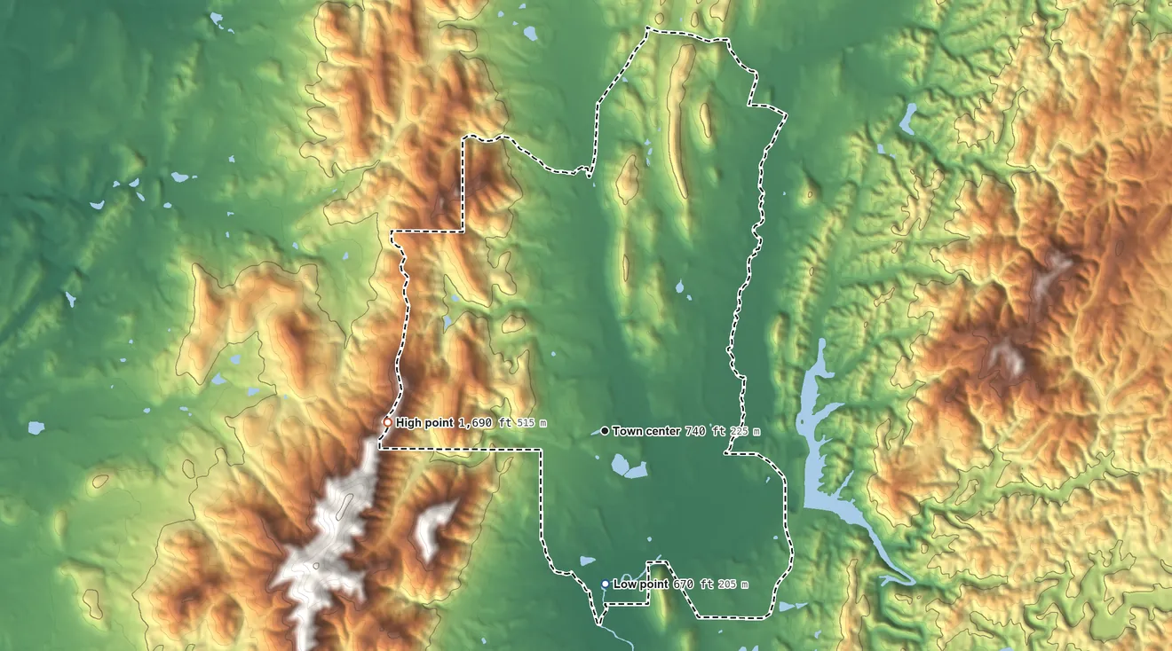 Topographic elevation map of White Plains, Alabama, shaded from 670 ft on the south side to 1,690 ft at the foot of the Big Pine Hills