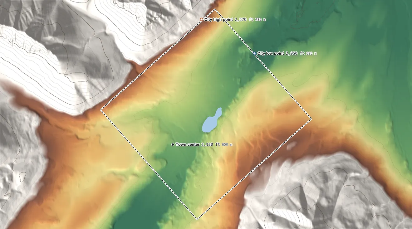 Topographic elevation map of Anaktuvuk Pass, Alaska, shaded from 2,050 ft on the northeast side to 2,570 ft on the north edge, below higher ground just outside