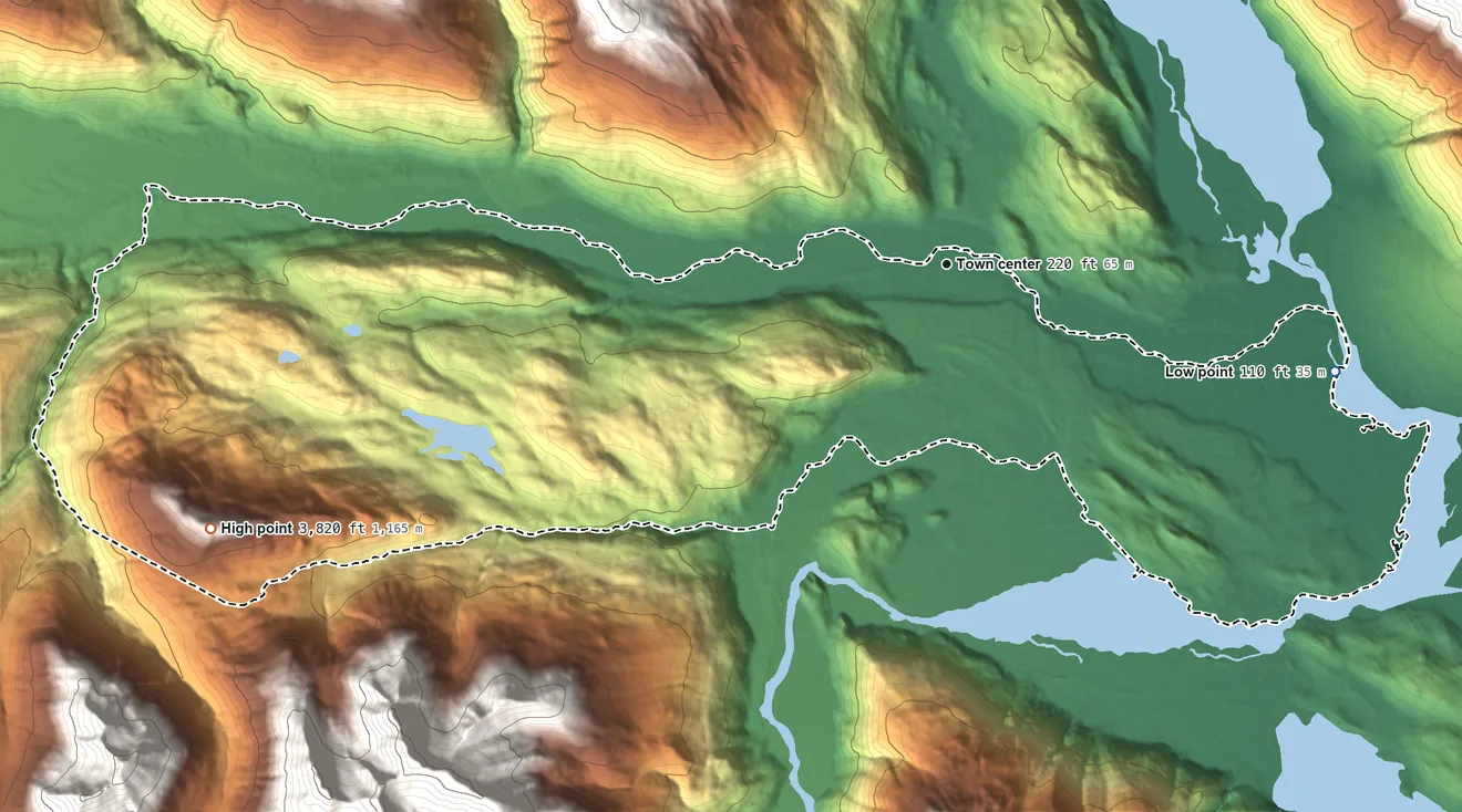 Topographic elevation map of Covenant Life, Alaska, shaded from 110 ft on the east side to 3,820 ft at the foot of the Takhinsha Mountains