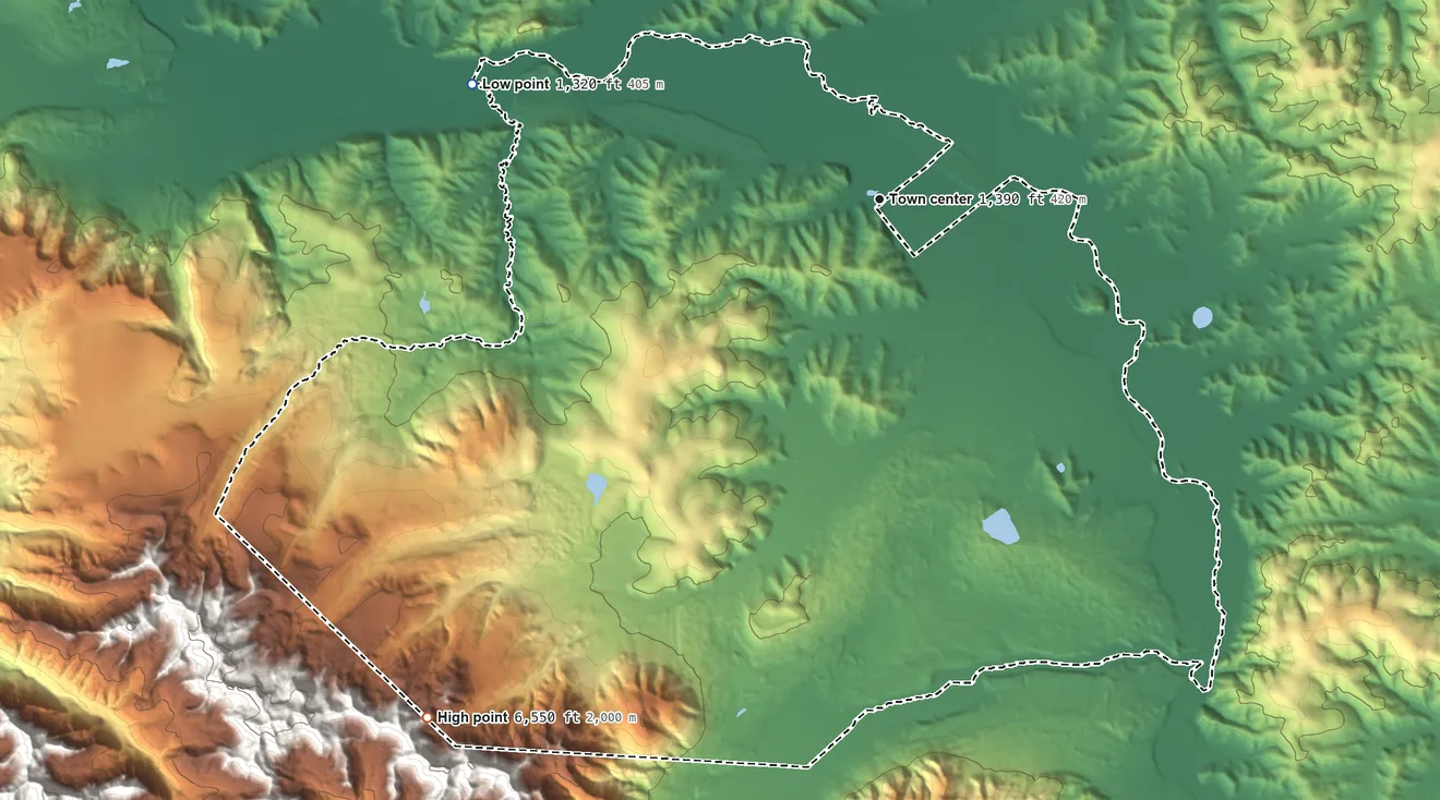 Topographic elevation map of Dot Lake, Alaska, shaded from 1,320 ft on the west side to 6,550 ft on the southwest edge, below higher ground just outside
