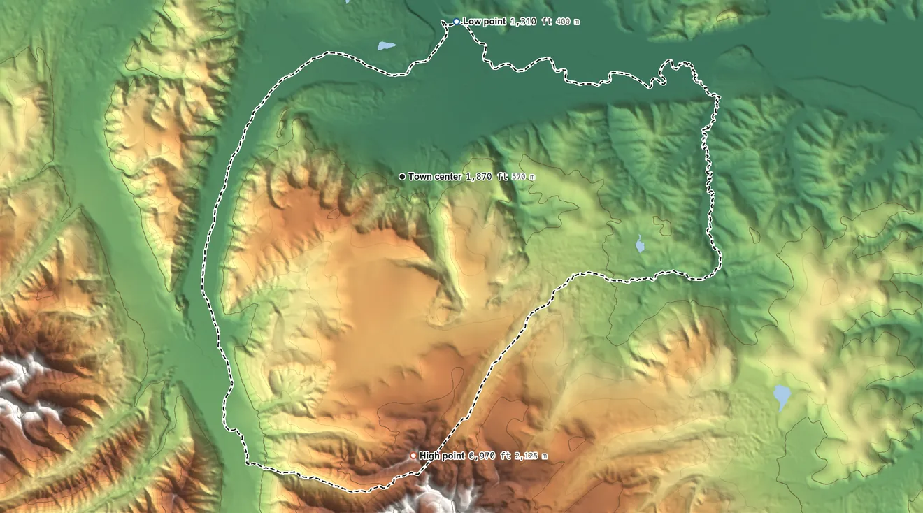 Topographic elevation map of Dry Creek, Alaska, shaded from 1,310 ft on the north side to 6,970 ft on the south edge, below higher ground just outside
