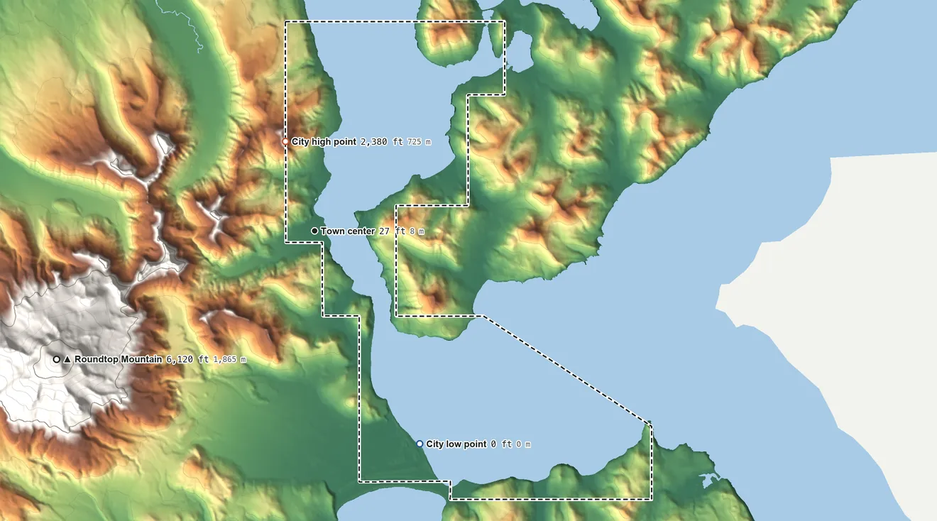 Topographic elevation map of False Pass, Alaska, shaded from sea level level on Ikatan Bay to 2,380 ft on the north side