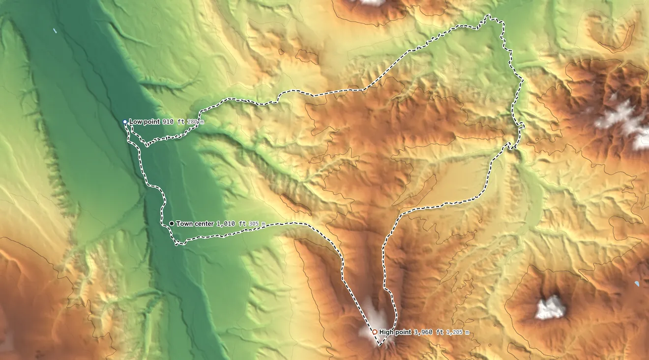 Topographic elevation map of Ferry, Alaska, shaded from 910 ft on the northwest side to 3,960 ft on Walker Dome