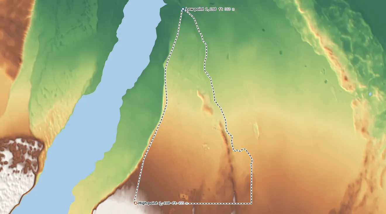 Topographic elevation map of Fort Greely, Alaska, shaded from 1,180 ft on the north side to 1,490 ft on the southwest side