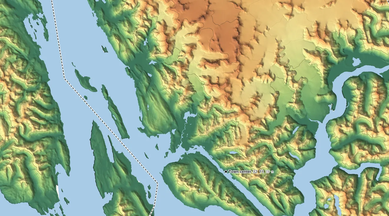 Topographic elevation map of Juneau, Alaska, shaded from sea level level on Berners Bay to 8,270 ft on the northeast edge, below higher ground just outside