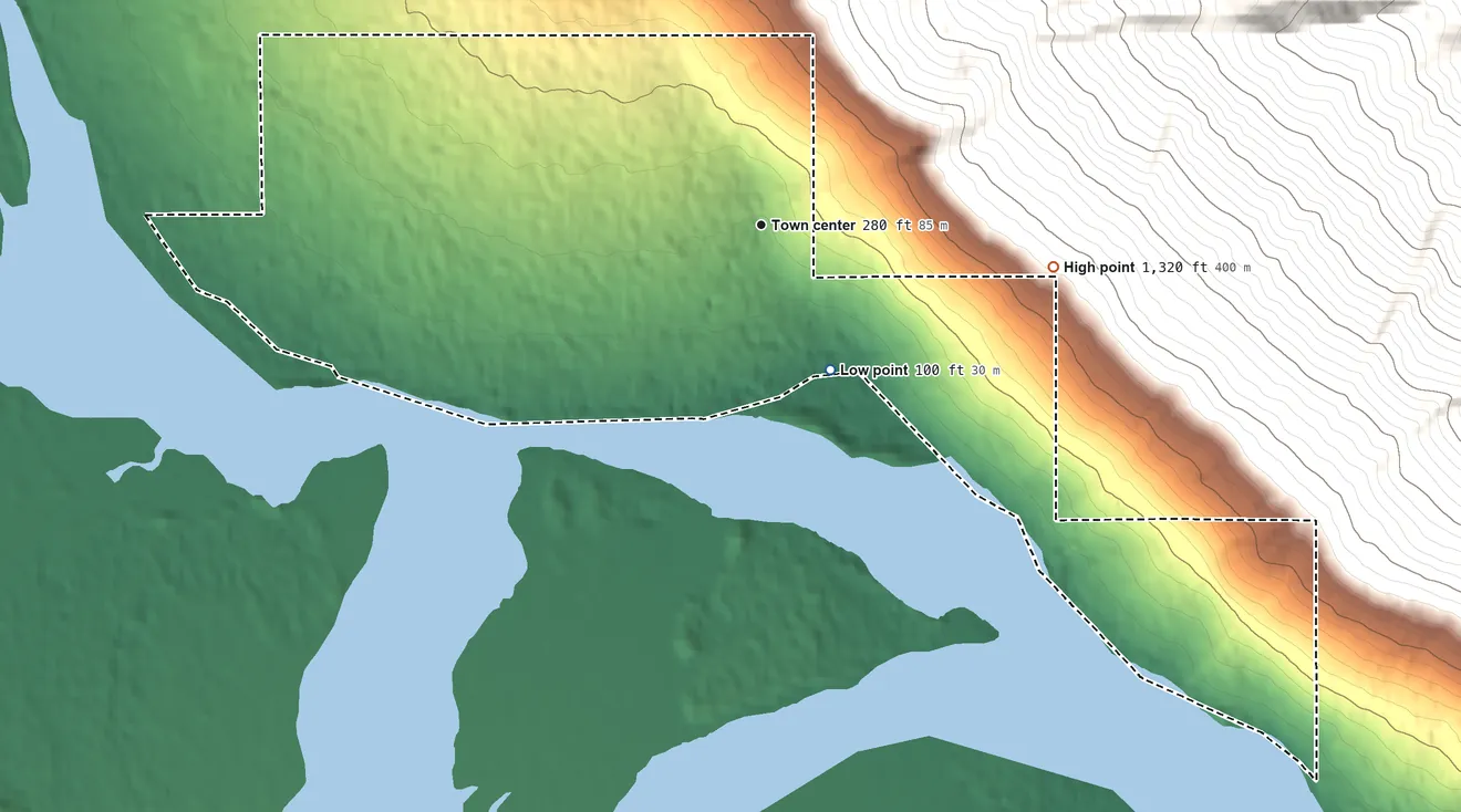 Topographic elevation map of Klukwan, Alaska, shaded from 100 ft on the southeast side to 1,320 ft at the foot of the Takshanuk Mountains