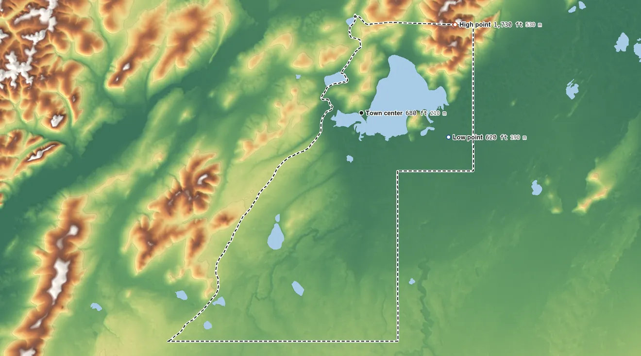 Topographic elevation map of Lake Minchumina, Alaska, shaded from 620 ft on the east side to 1,730 ft on the northeast side