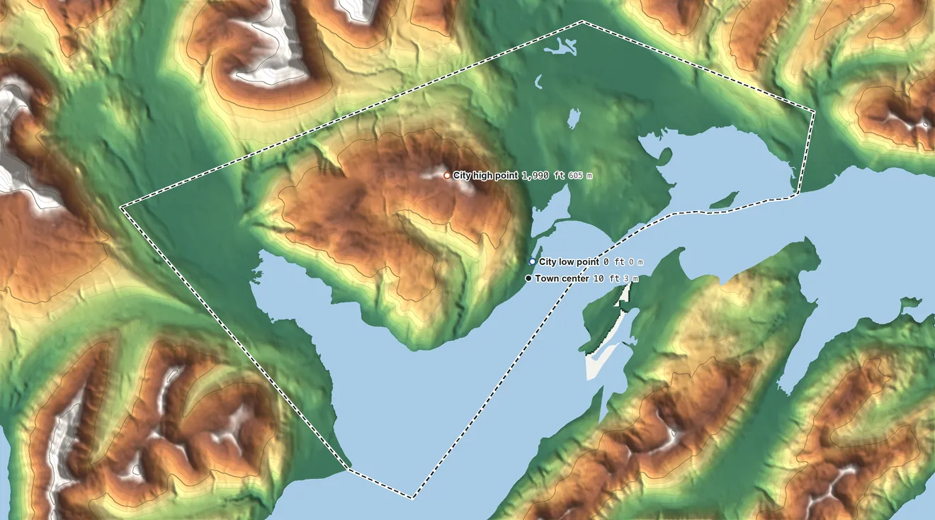 Topographic elevation map of Old Harbor, Alaska, shaded from sea level level on the Sitkalidak Strait to 1,990 ft on the northwest side