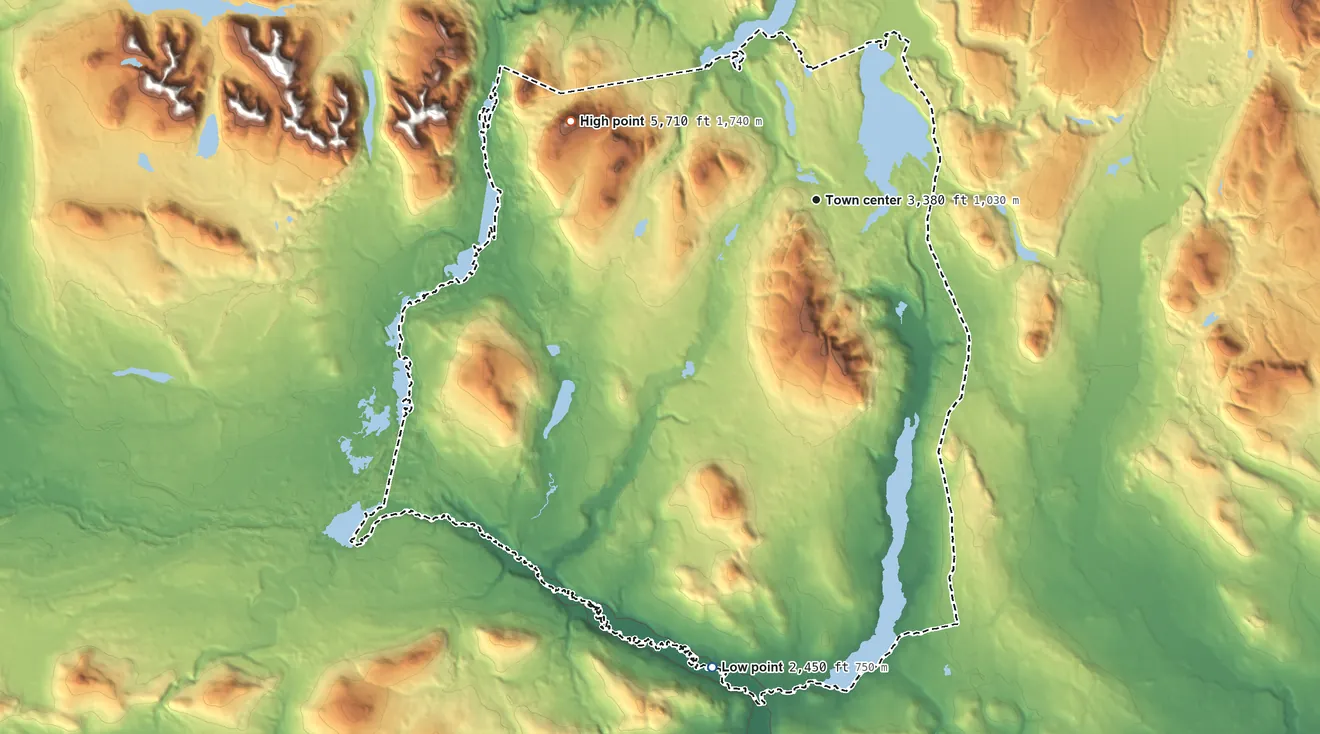 Topographic elevation map of Paxson, Alaska, shaded from 2,450 ft on the south side to 5,710 ft on the west side