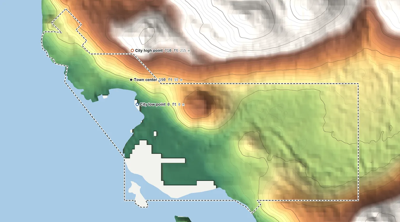 Topographic elevation map of Pelican, Alaska, shaded from sea level level on Lisianski Inlet to 710 ft on the north edge, below higher ground just outside