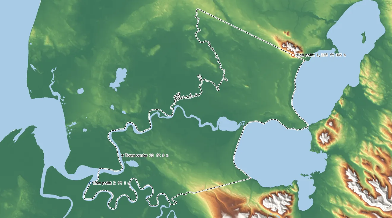 Topographic elevation map of Ugashik, Alaska, shaded from 2 ft on the southwest side to 1,130 ft on the northeast edge, below higher ground just outside