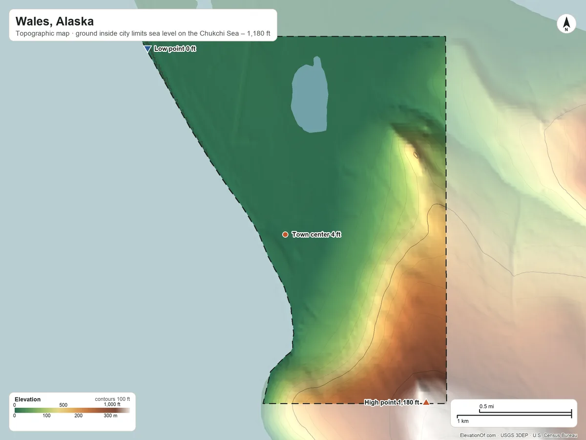 Topographic elevation map of Wales, Alaska, shaded from sea level level on the Chukchi Sea to 1,180 ft on the southeast edge, below higher ground just outside