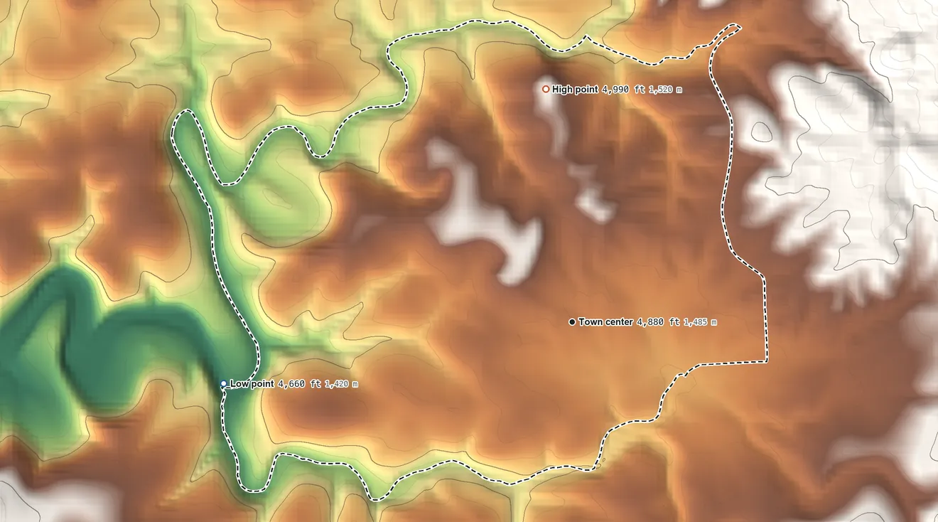 Topographic elevation map of Freedom Acres, Arizona, shaded from 4,660 ft on the west side to 4,990 ft at the foot of the White Hills
