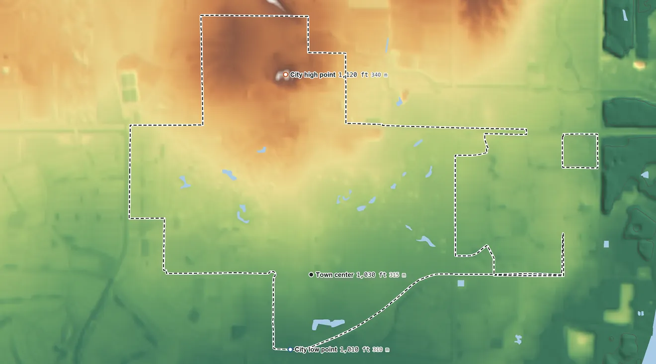 Topographic elevation map of Litchfield Park, Arizona, shaded from 1,010 ft on the south side to 1,120 ft on the north side