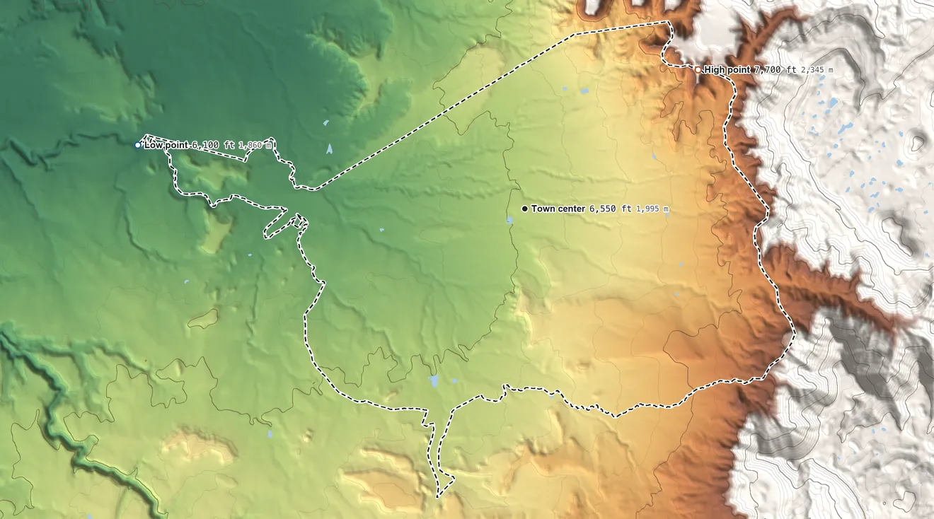 Topographic elevation map of Lukachukai, Arizona, shaded from 6,100 ft on the west side to 7,700 ft at the foot of the Lukachukai Mountains