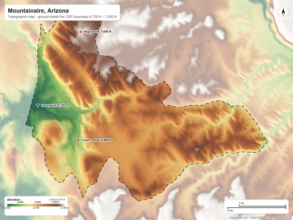 Topographic elevation map of Mountainaire, Arizona, shaded from 6,730 ft on the northwest side to 7,050 ft on the north side