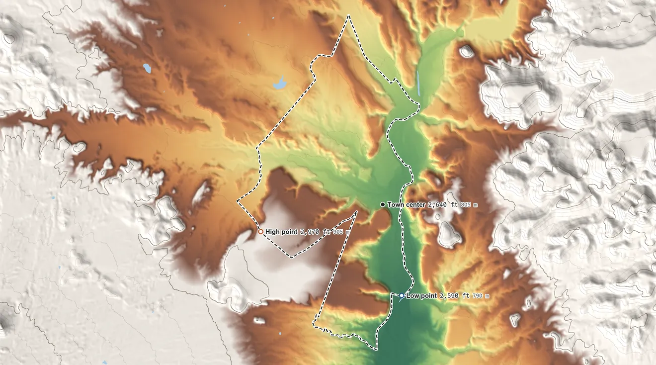 Topographic elevation map of San Carlos, Arizona, shaded from 2,590 ft on the south side to 2,970 ft on the west side
