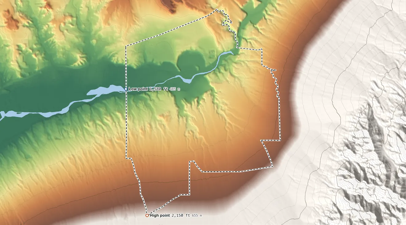 Topographic elevation map of Scenic, Arizona, shaded from 1,580 ft on the west side to 2,150 ft on the southwest edge, below higher ground just outside