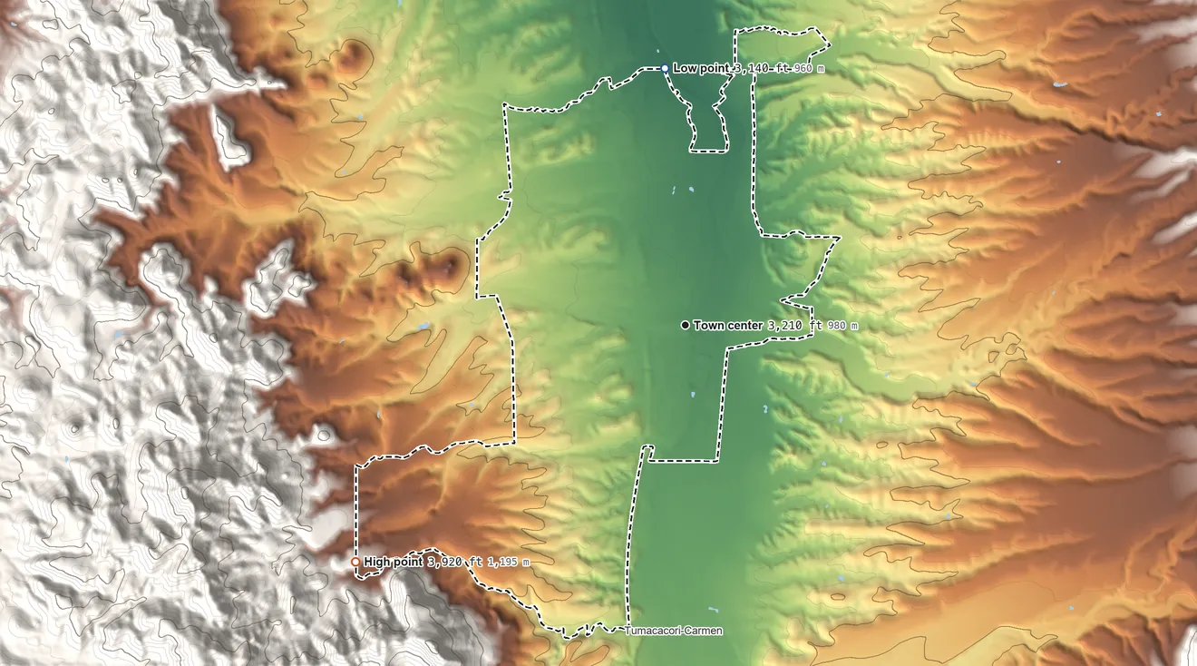 Topographic elevation map of Tubac, Arizona, shaded from 3,140 ft on the north side to 3,920 ft at the foot of the Tumacacori Mountains