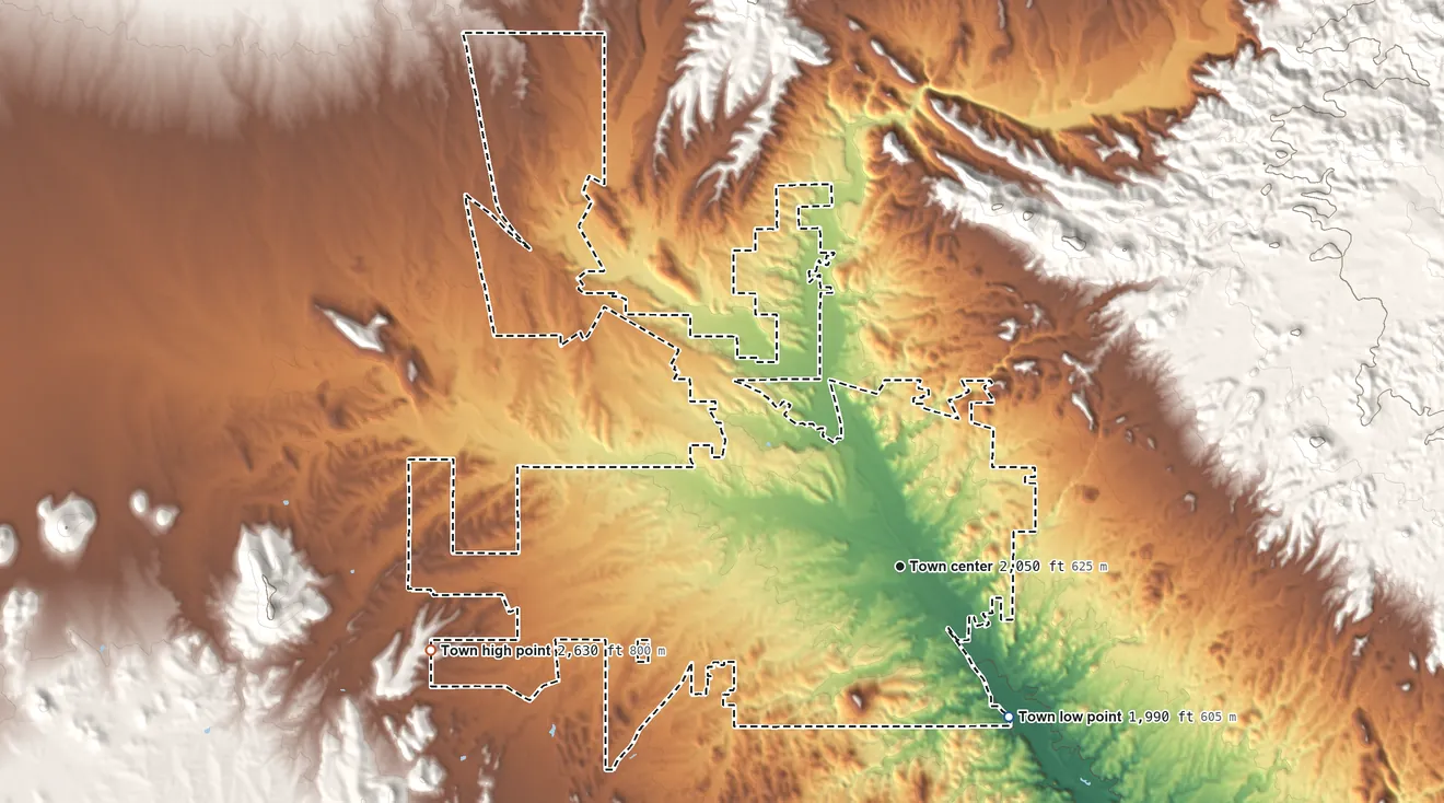 Topographic elevation map of Wickenburg, Arizona, shaded from 1,990 ft on the southeast side to 2,630 ft at the foot of the Vulture Mountains