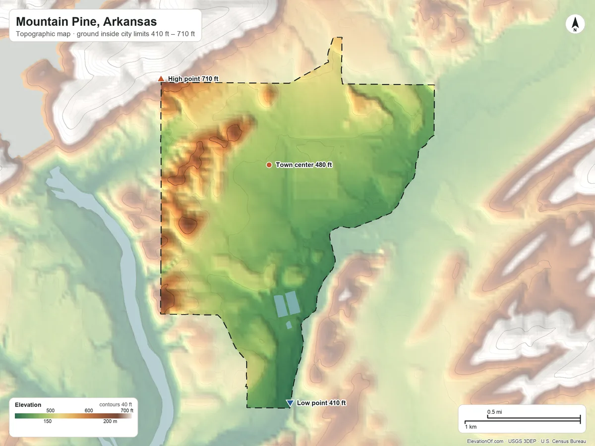 Topographic elevation map of Mountain Pine, Arkansas, shaded from 410 ft on the south side to 710 ft on the northwest edge, below higher ground just outside