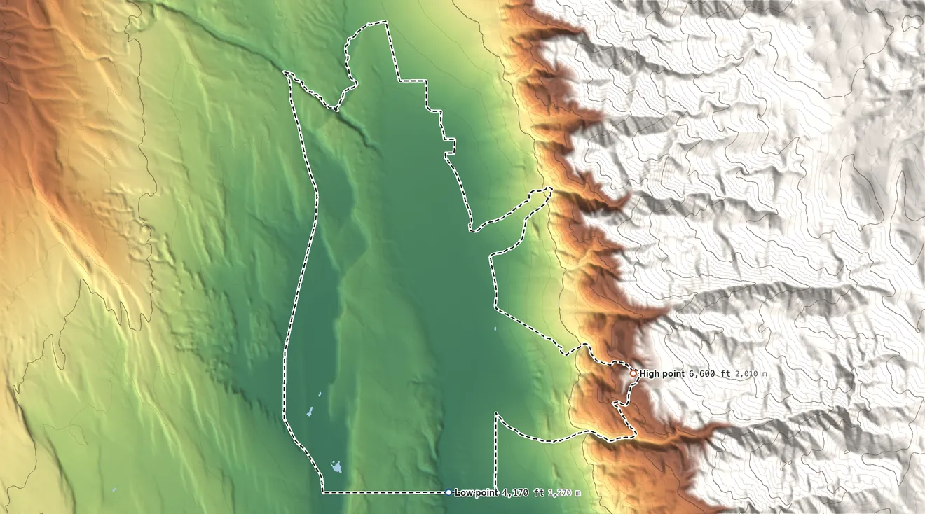 Topographic elevation map of Chalfant, California, shaded from 4,170 ft on the south side to 6,600 ft at the foot of the White Mountains