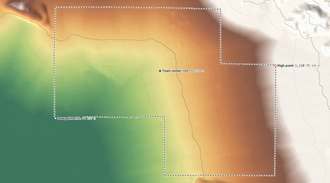 Topographic elevation map of Desert Edge, California, shaded from 890 ft on the southwest side to 1,130 ft at the foot of the Little San Bernardino Mountains