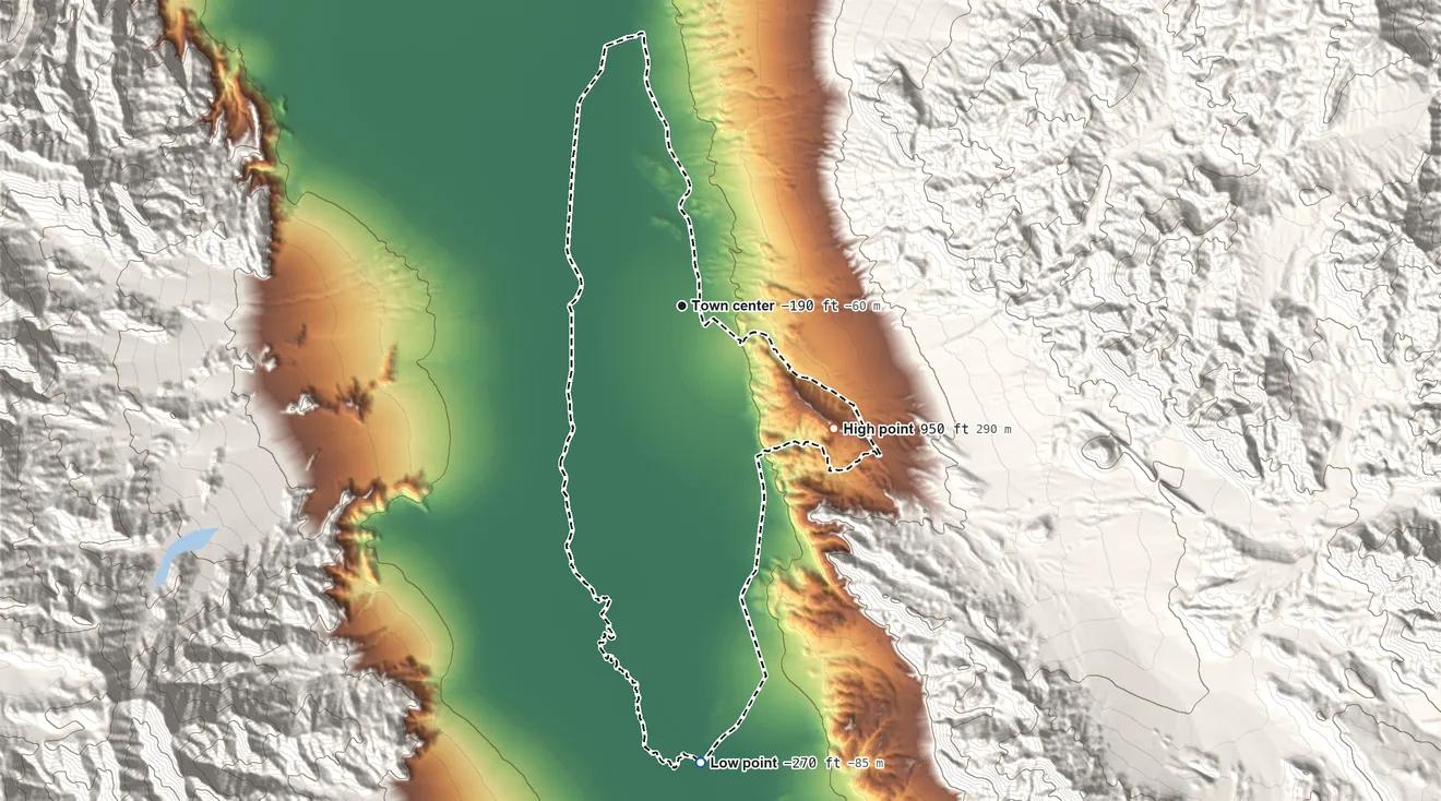 Topographic elevation map of Furnace Creek, California, shaded from −270 ft on the south side to 950 ft at the foot of the Funeral Mountains