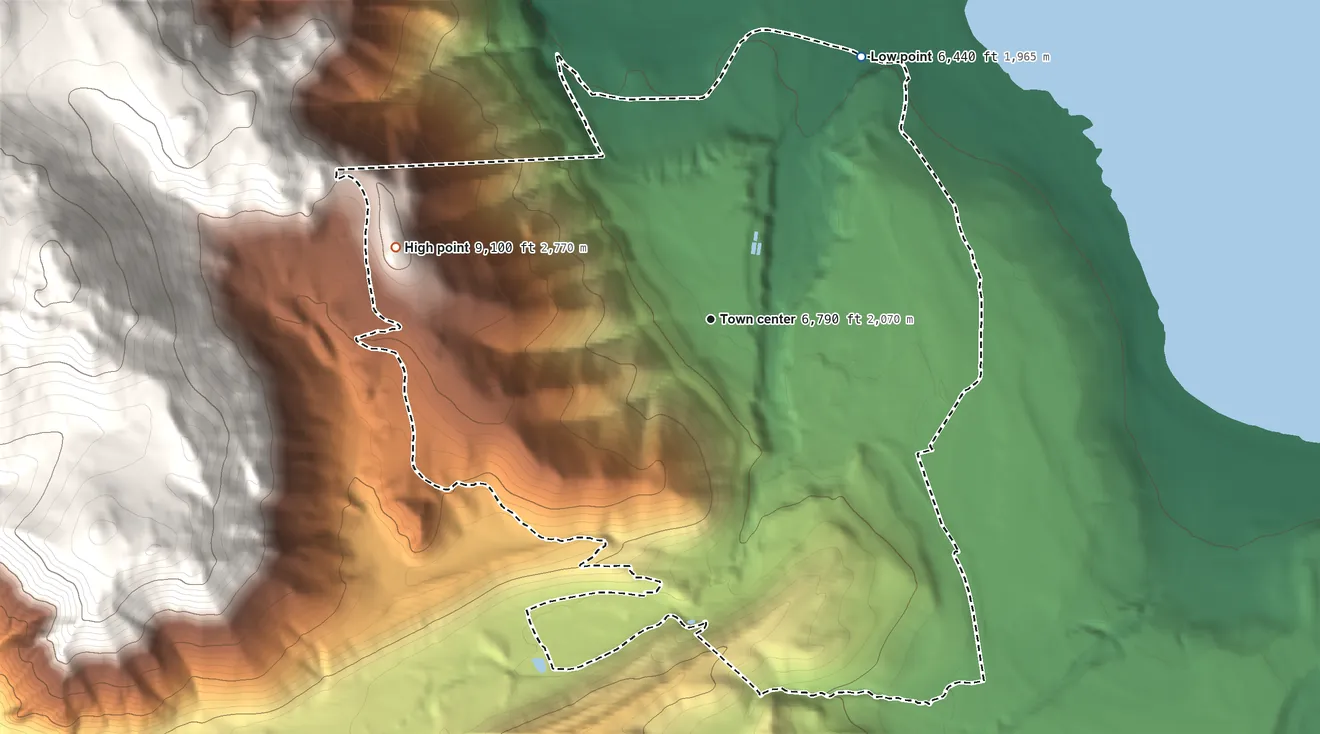 Topographic elevation map of Lee Vining, California, shaded from 6,440 ft on the northeast side to 9,100 ft on the west edge, below higher ground just outside