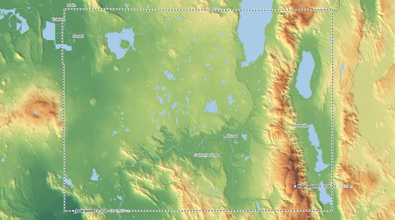 Topographic elevation map of Modoc County, California, shaded from 3,440 ft on the southwest side to 9,880 ft on Eagle Peak