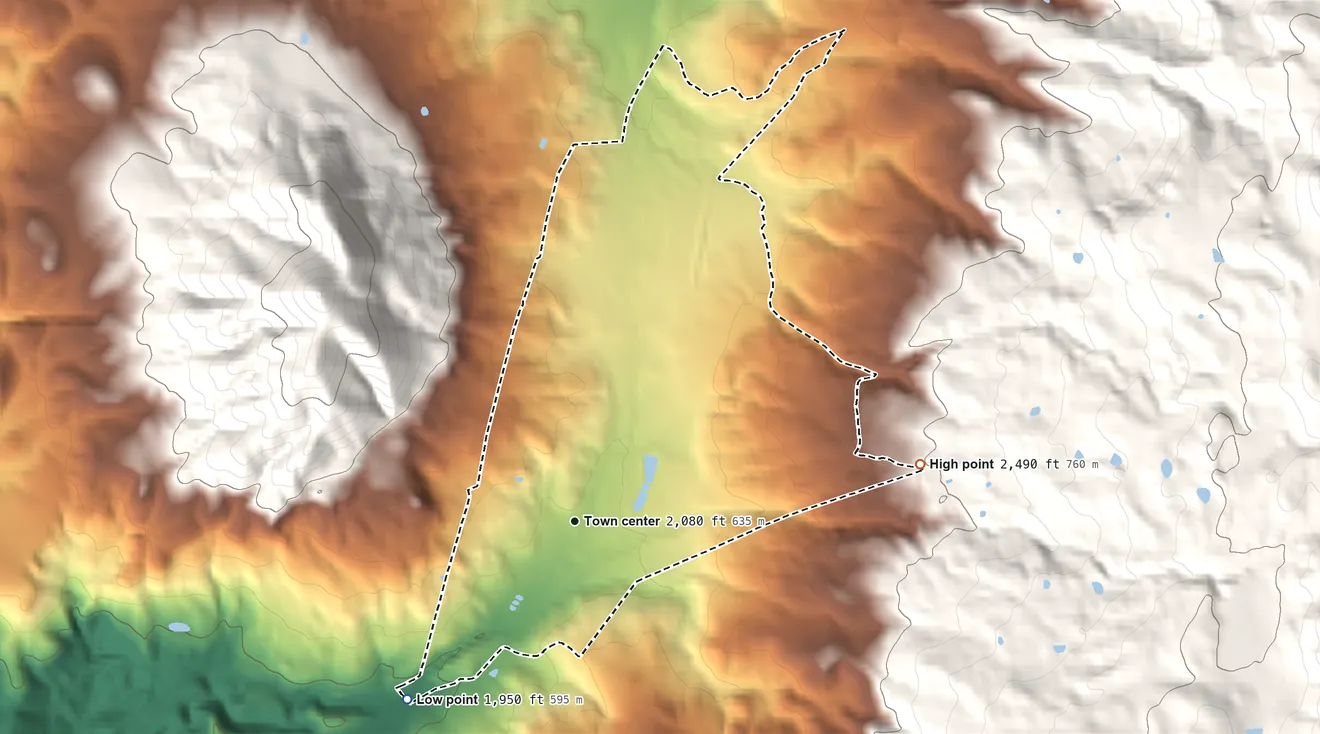 Topographic elevation map of Round Mountain, California, shaded from 1,950 ft on the southwest side to 2,490 ft on the east edge, below higher ground just outside