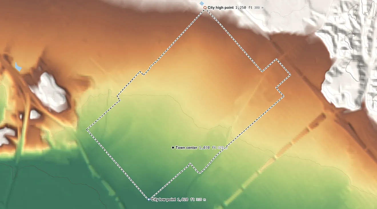 Topographic elevation map of San Fernando, California, shaded from 1,020 ft on the southwest side to 1,250 ft at the foot of the Santa Susana Mountains