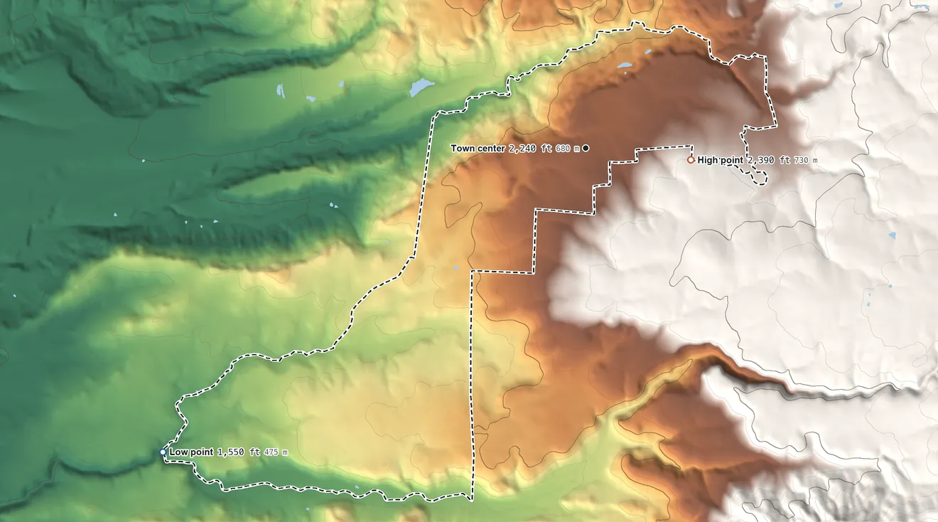 Topographic elevation map of Whitmore, California, shaded from 1,550 ft on the southwest side to 2,390 ft on the east side