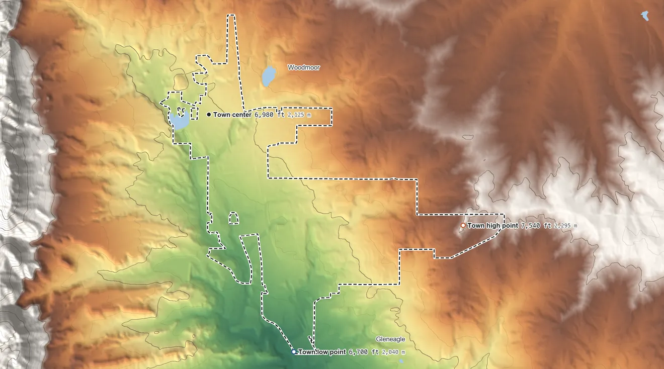 Topographic elevation map of Monument, Colorado, shaded from 6,700 ft on the south side to 7,540 ft on the southeast side