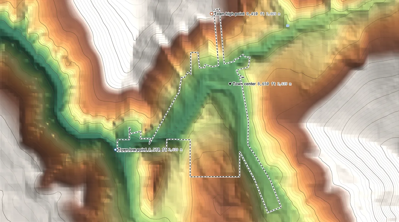 Topographic elevation map of Red Cliff, Colorado, shaded from 8,570 ft on the southwest side to 9,410 ft on the north edge, below higher ground just outside