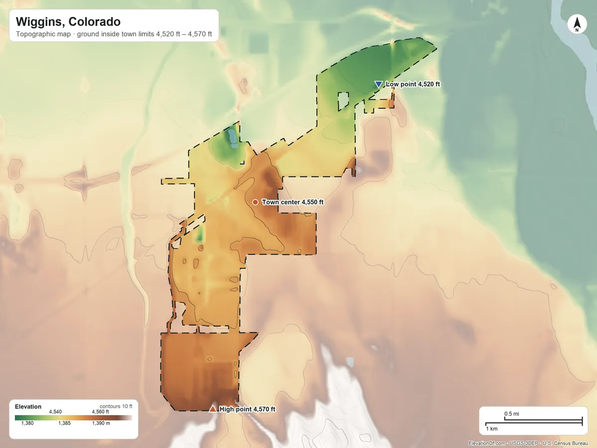 Topographic elevation map of Wiggins, Colorado, shaded from 4,520 ft on the northeast side to 4,570 ft on the south side