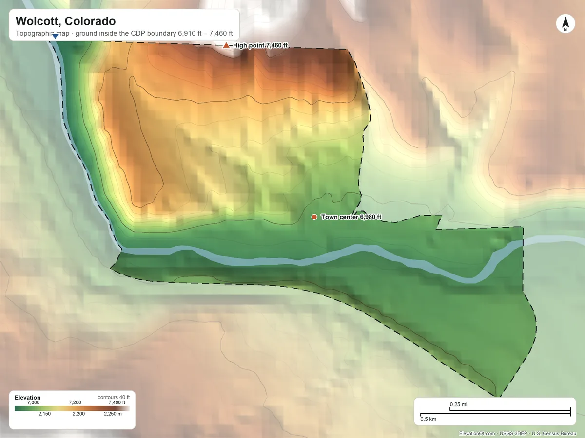 Topographic elevation map of Wolcott, Colorado, shaded from 6,910 ft on the northwest side to 7,460 ft on the northwest edge, below higher ground just outside