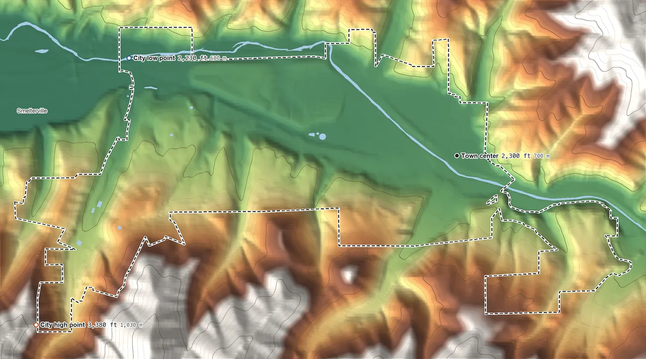 Topographic elevation map of Kellogg, Idaho, shaded from 2,230 ft on the west side to 3,380 ft on the west edge, below higher ground just outside