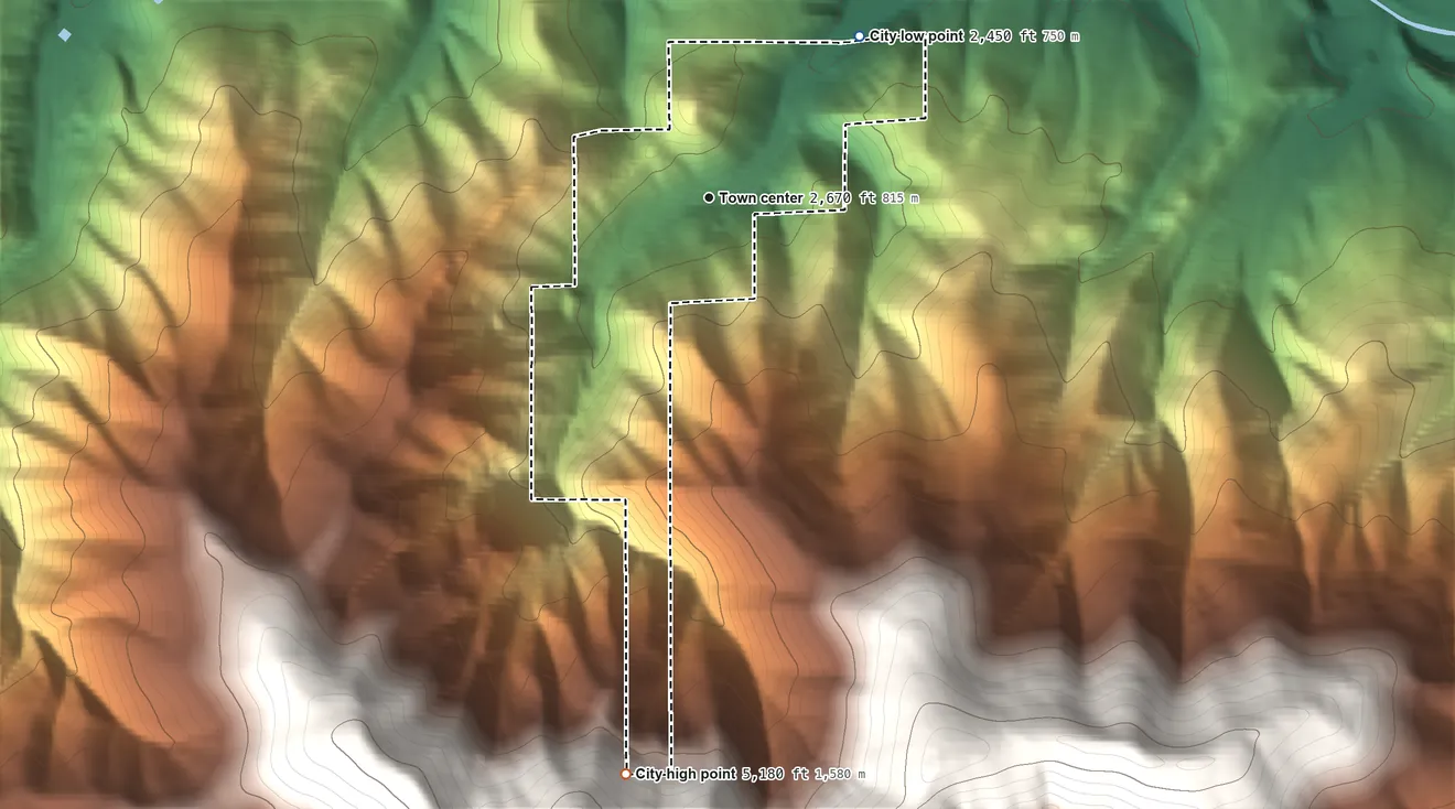 Topographic elevation map of Wardner, Idaho, shaded from 2,450 ft on the northeast side to 5,180 ft on the south edge, below higher ground just outside