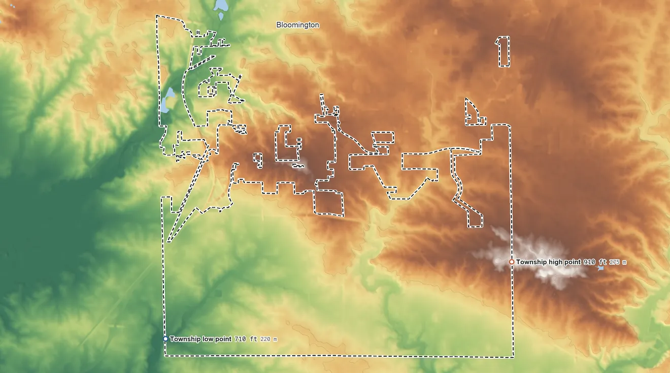 Topographic elevation map of Bloomington Township, Illinois, shaded from 710 ft on the southwest side to 910 ft on the east side