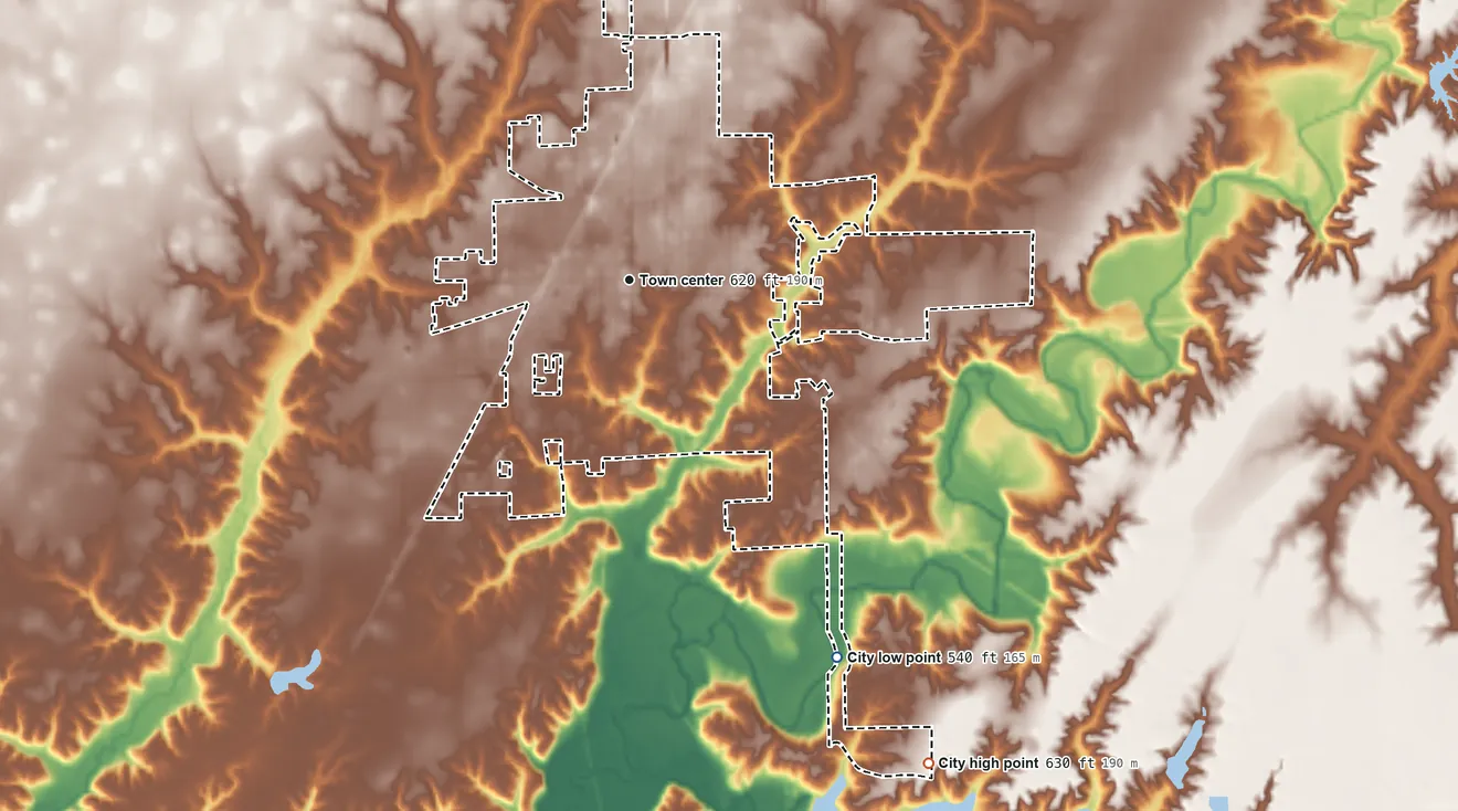 Topographic elevation map of Carlinville, Illinois, shaded from 540 ft on the southeast side to 630 ft on the southeast side