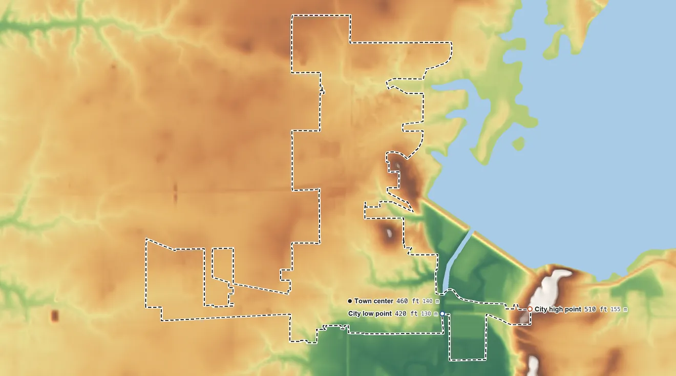 Topographic elevation map of Carlyle, Illinois, shaded from 420 ft on the east side to 510 ft on the east side