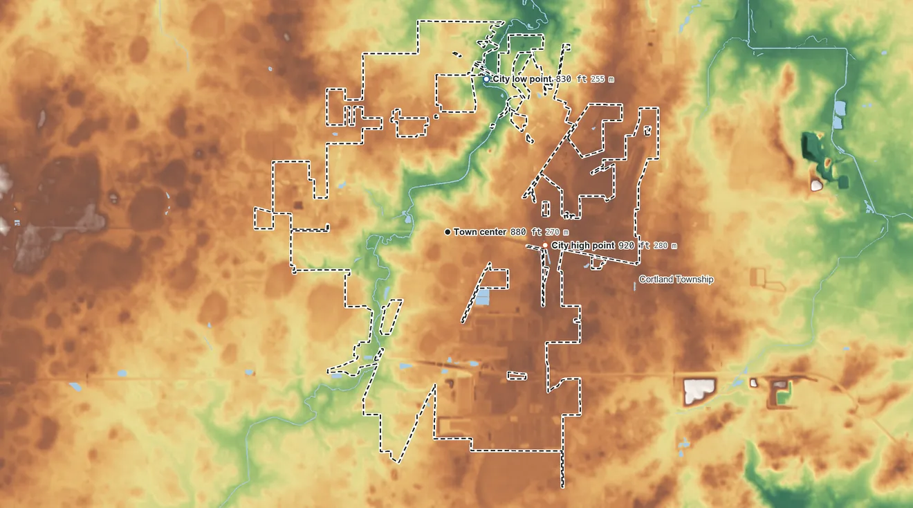 Topographic elevation map of DeKalb, Illinois, shaded from 830 ft on the north side to 920 ft on the east side